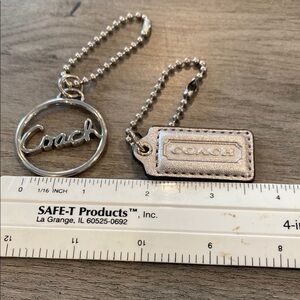 Set of 2 silver Coach hang tags